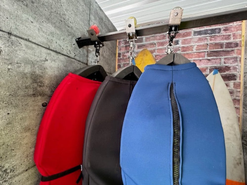 Board cradles riding side-by-side on the slide track.