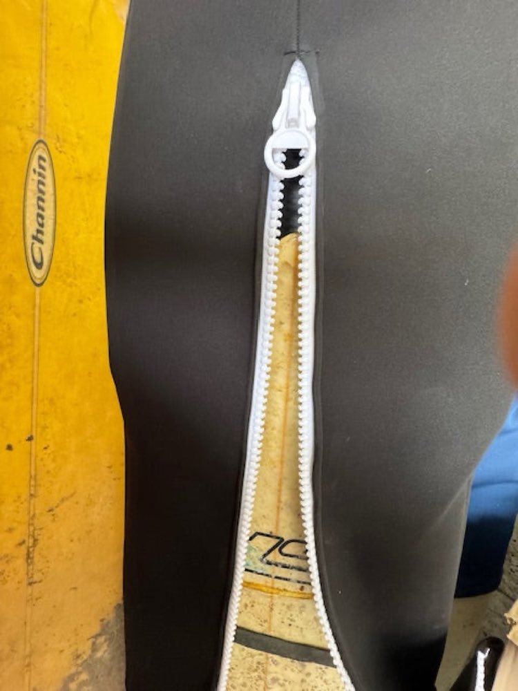 Girdle ready to zip down and secure the surfboard.
