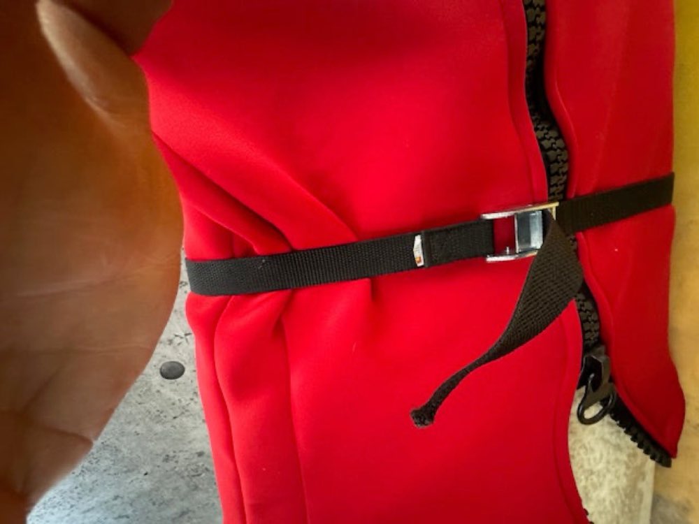 Girdle zipped, with the snug strap securing the board.