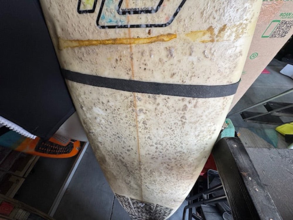 Lift leash around the board, secured around the ZigZag cleat.