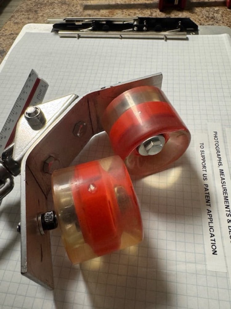 Slide-guide skate-wheel hardware, up close.